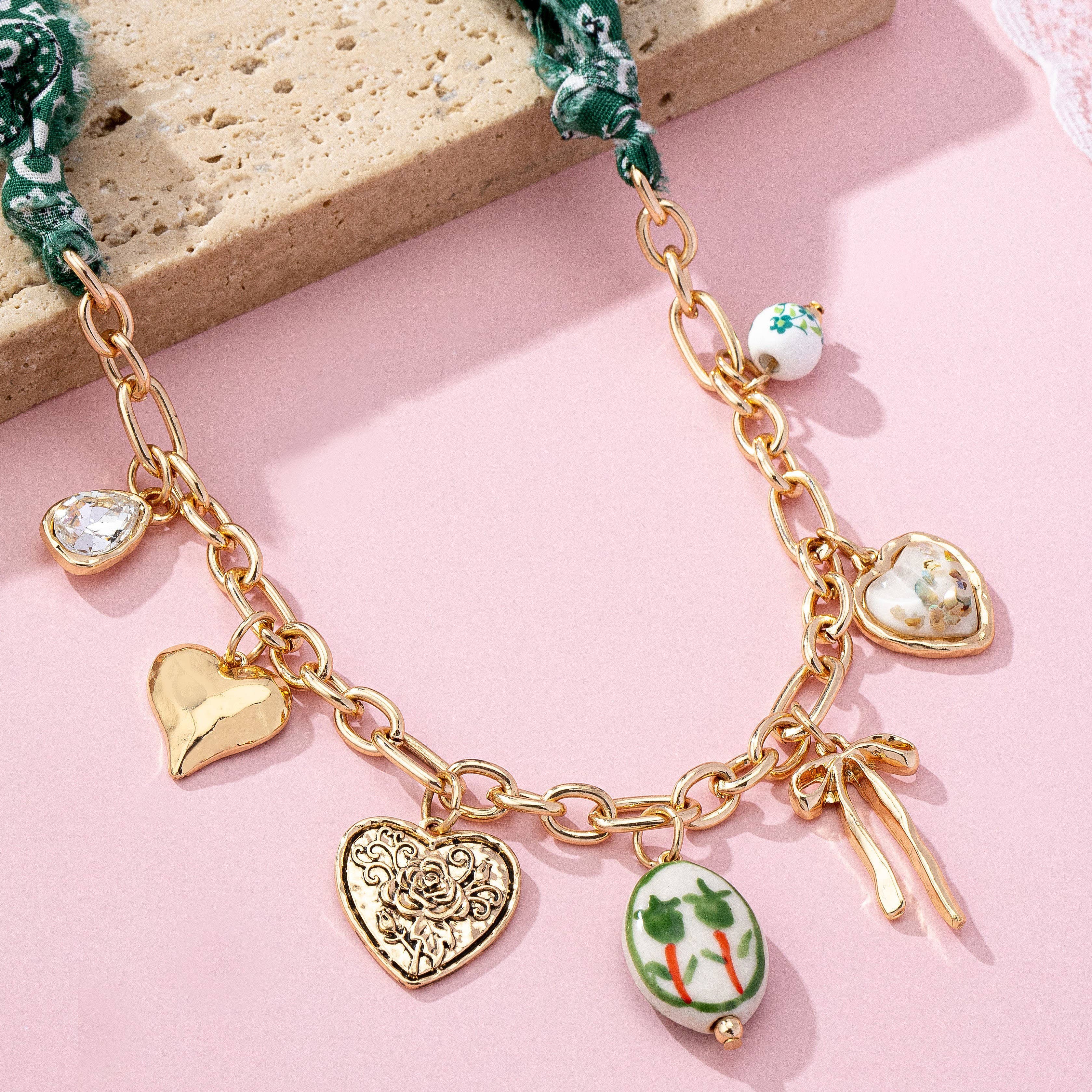 SCARF CHARM NECKLACE-PORCELAIN HEART BOW | 80N92717 - Proper