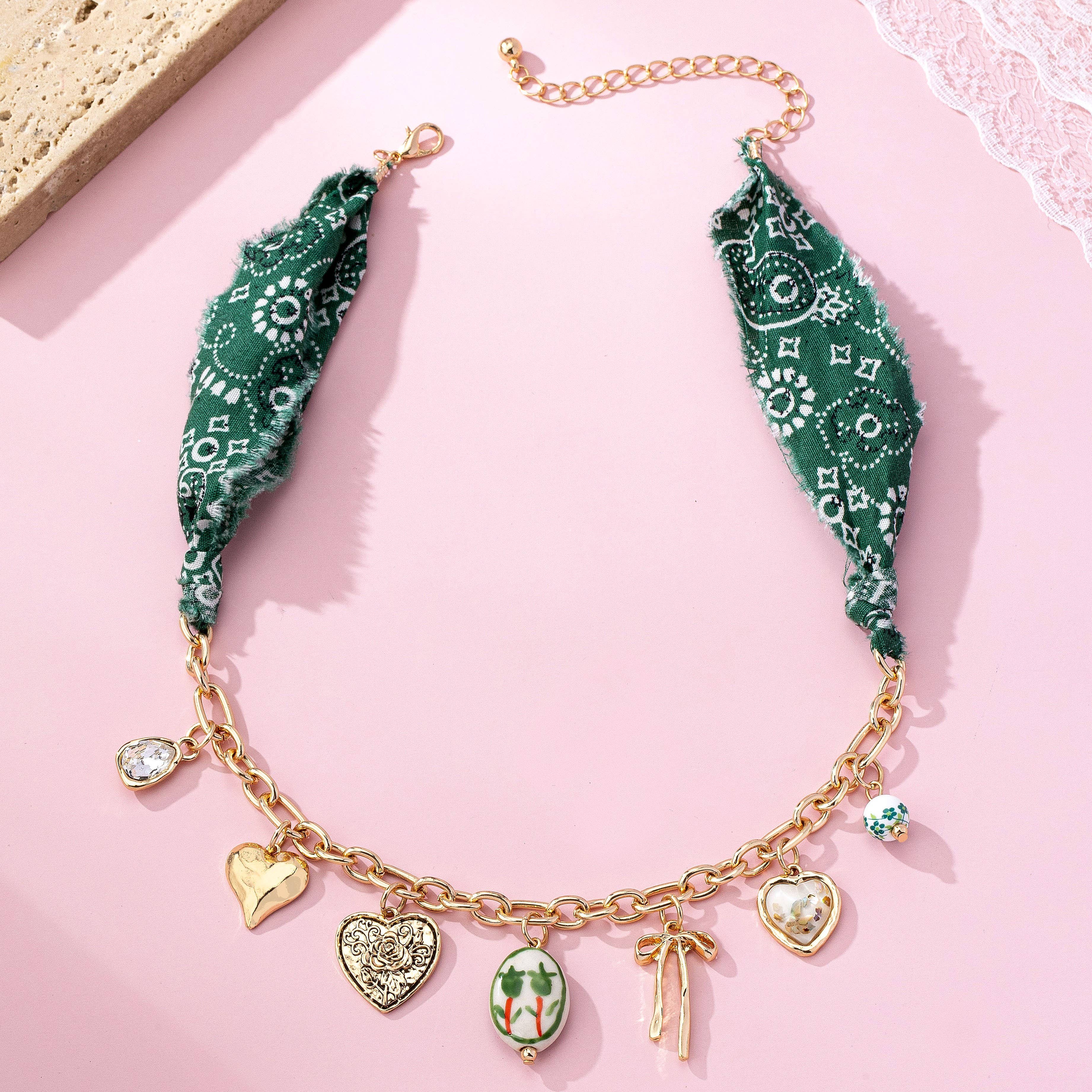 SCARF CHARM NECKLACE-PORCELAIN HEART BOW | 80N92717 - Proper